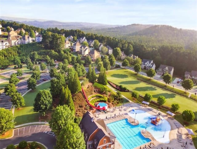 birds eye view of property featuring a mountain view