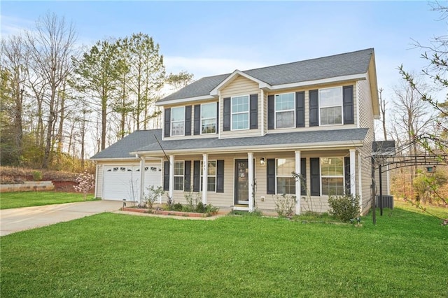 colonial house with central air condition unit, driveway, a porch, a front yard, and an attached garage