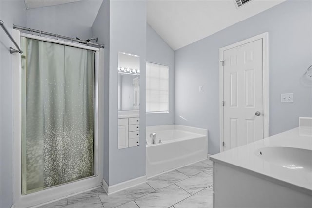 full bath with vaulted ceiling, marble finish floor, and a shower stall