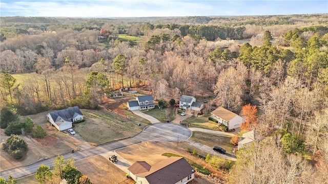 aerial view featuring a wooded view