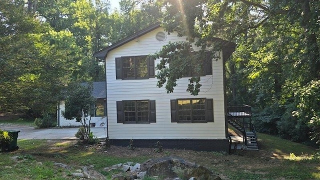 view of property exterior with stairs