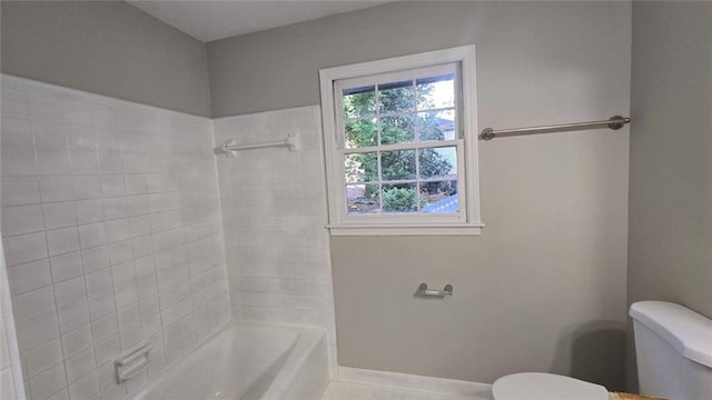 full bathroom featuring shower / washtub combination, baseboards, and toilet