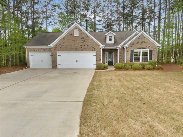 view of front of home featuring a front lawn and a garage