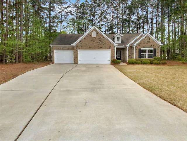 view of front of home featuring a garage and a front lawn