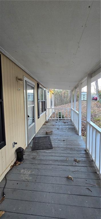 wooden terrace featuring a porch