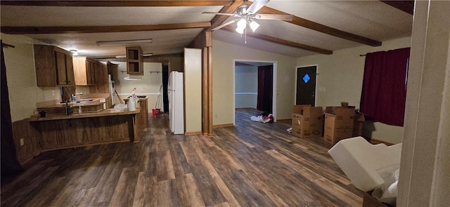 kitchen with ceiling fan, lofted ceiling with beams, dark hardwood / wood-style floors, white refrigerator, and kitchen peninsula