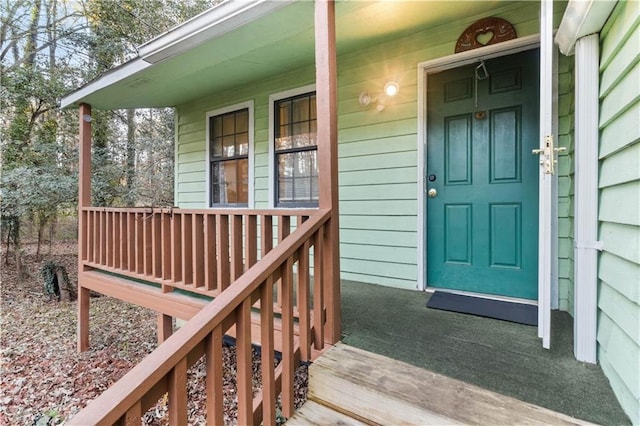 property entrance featuring covered porch