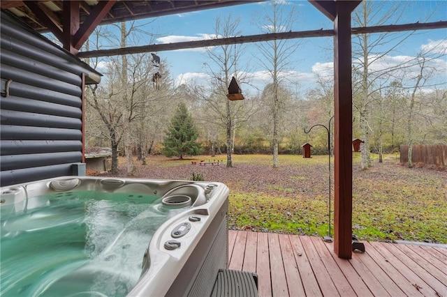 wooden terrace featuring a hot tub