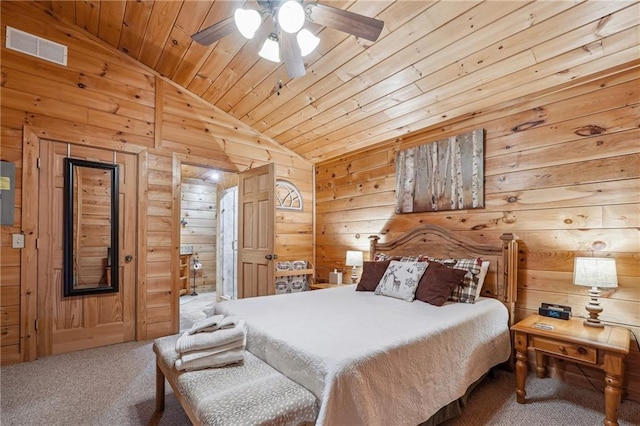 bedroom featuring vaulted ceiling, ceiling fan, wooden ceiling, carpet floors, and wood walls