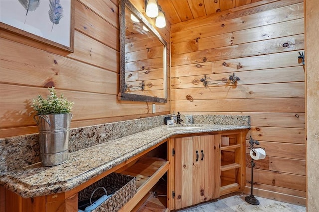 bathroom with wood walls, vanity, and wood ceiling