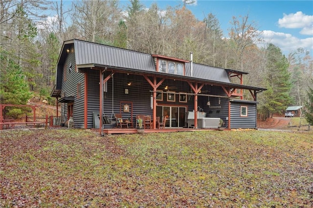 back of house with a yard and a wooden deck