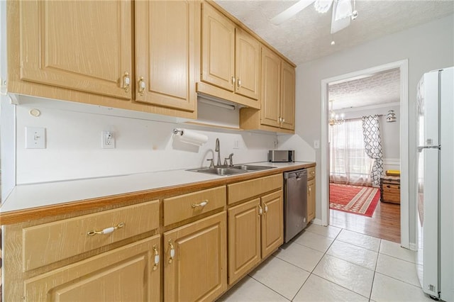 901 Elijah Way, Bethlehem, GA 30620 - kitchen with stainless steel dishwasher, freestanding refrigerator, a sink, light countertops, and light tile patterned floors