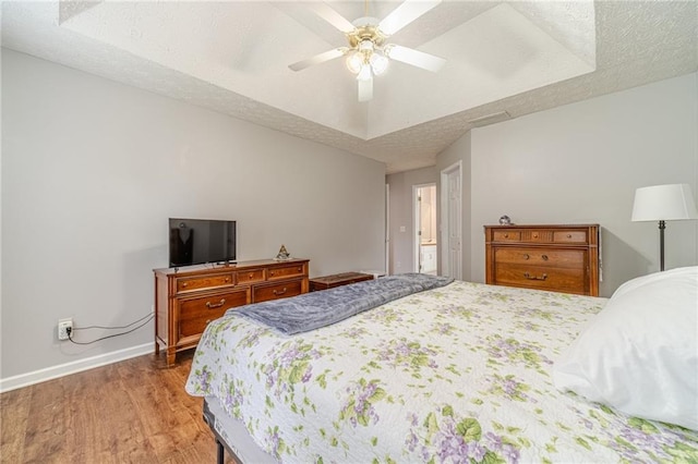 901 Elijah Way, Bethlehem, GA 30620 - bedroom with wood finished floors, baseboards, a ceiling fan, and a textured ceiling