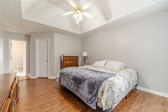 901 Elijah Way, Bethlehem, GA 30620 - bedroom with baseboards, wood finished floors, a textured ceiling, and a ceiling fan