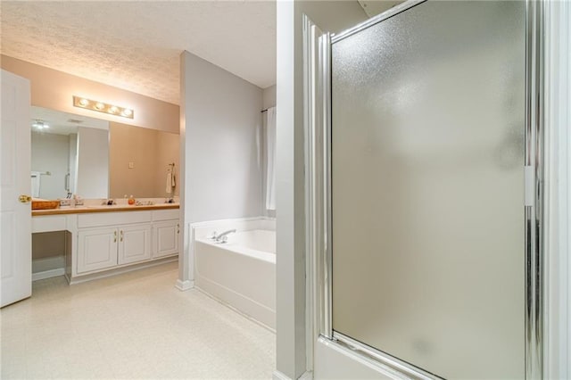 901 Elijah Way, Bethlehem, GA 30620 - full bath with a stall shower, a bath, double vanity, tile patterned floors, and a textured ceiling