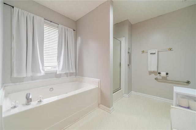 901 Elijah Way, Bethlehem, GA 30620 - bathroom featuring a bath, a stall shower, tile patterned floors, and baseboards