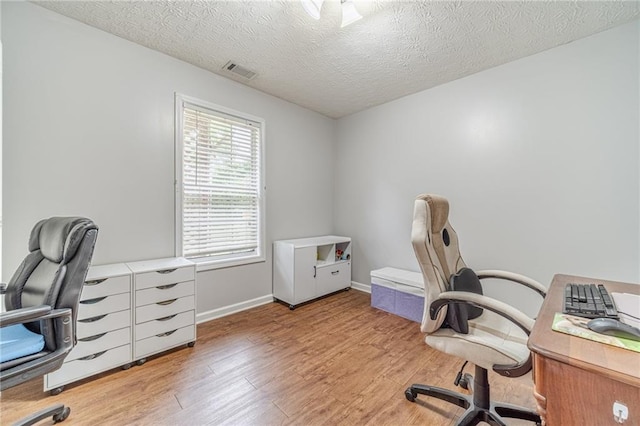 901 Elijah Way, Bethlehem, GA 30620 - office with light wood-style flooring, a textured ceiling, and baseboards