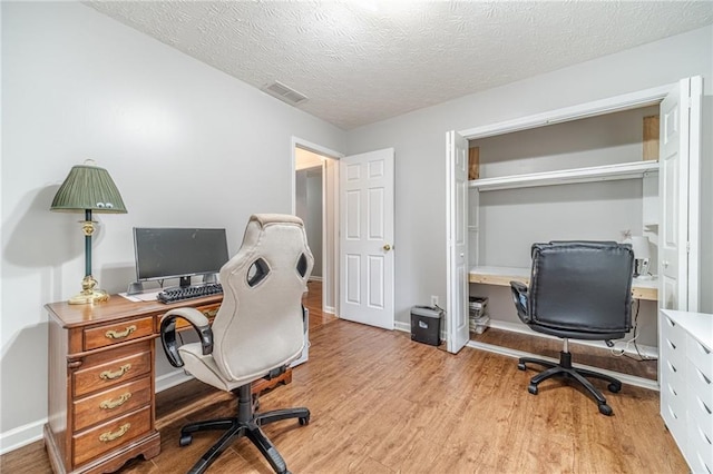 901 Elijah Way, Bethlehem, GA 30620 - office with light wood-style flooring, a textured ceiling, and baseboards