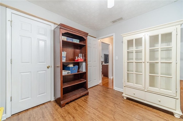 901 Elijah Way, Bethlehem, GA 30620 - unfurnished bedroom with light wood finished floors, a textured ceiling, and baseboards