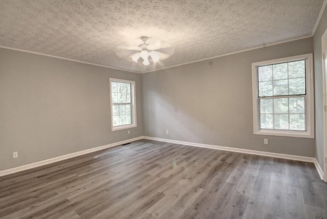 2773 Hawk Trace Ct NE, Marietta, GA 30066 - spare room featuring a ceiling fan, dark wood-type flooring, and ornamental molding
