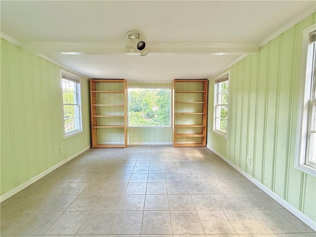 2437 N Decatur Rd, Decatur, GA 30033 - spare room with crown molding, plenty of natural light, built in features, light tile patterned flooring, and baseboards