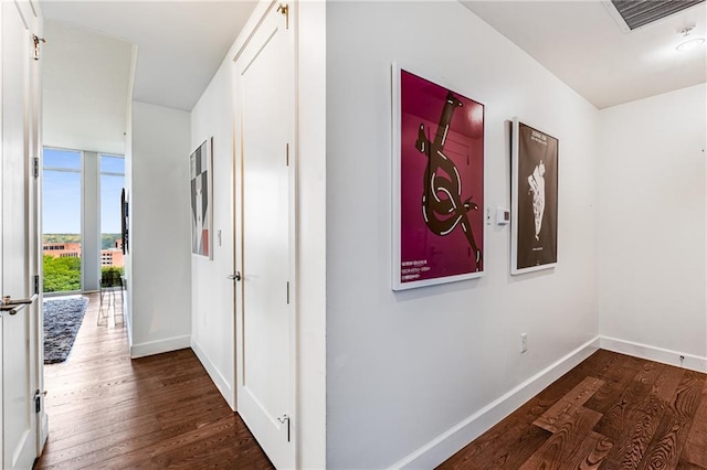 corridor featuring dark wood-type flooring