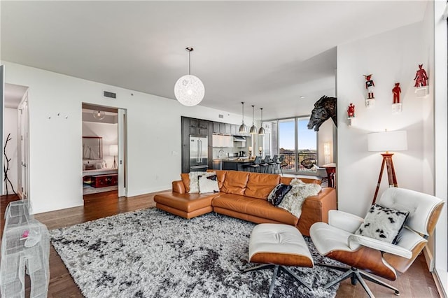 living room featuring dark wood-type flooring