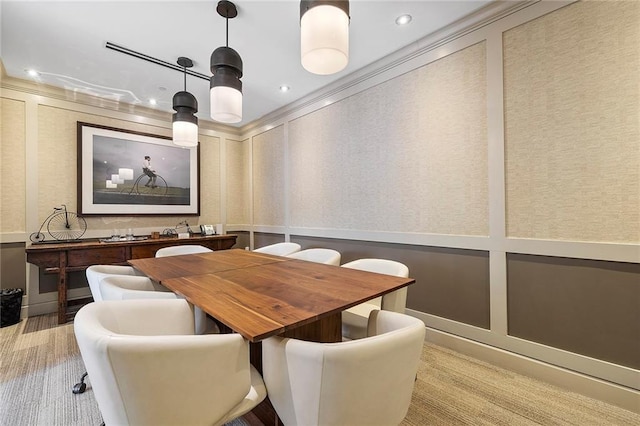 carpeted dining room with crown molding