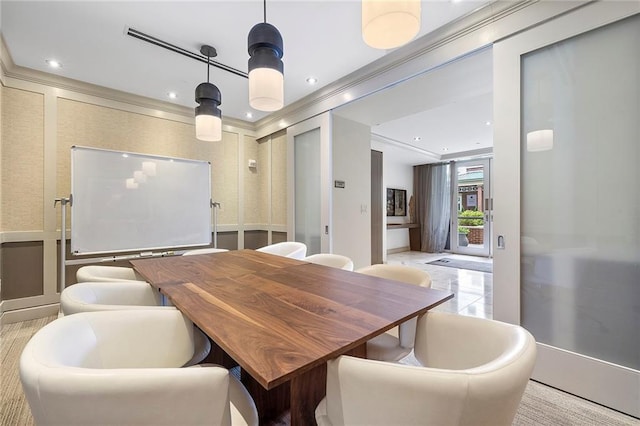 dining area featuring crown molding