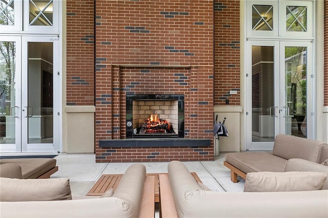 interior space featuring french doors and a fireplace