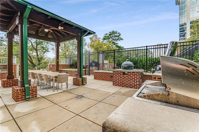 view of patio with area for grilling and a gazebo