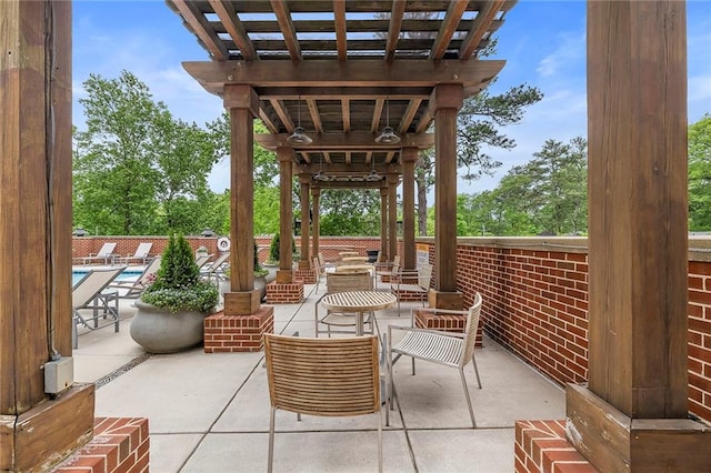 view of patio / terrace featuring a pergola and a community pool