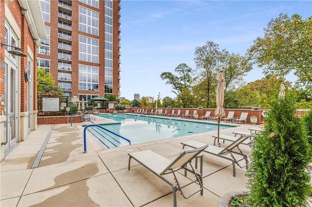 view of swimming pool with a patio area