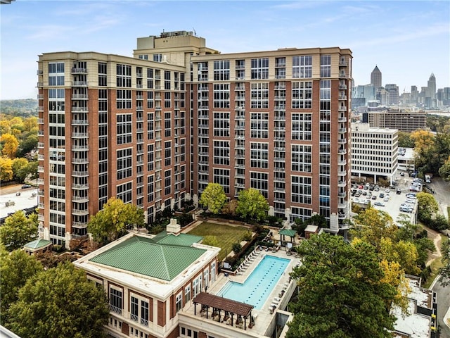 view of building exterior featuring a community pool