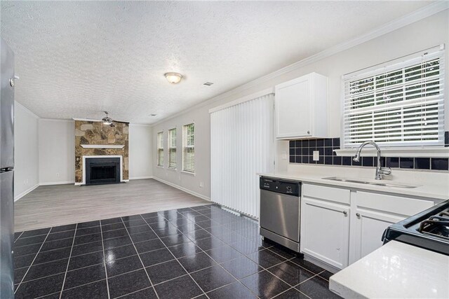 kitchen with dishwasher, sink, dark hardwood / wood-style flooring, and white cabinetry