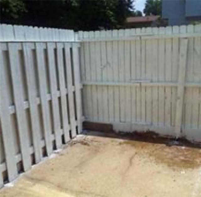 view of gate featuring a fenced backyard