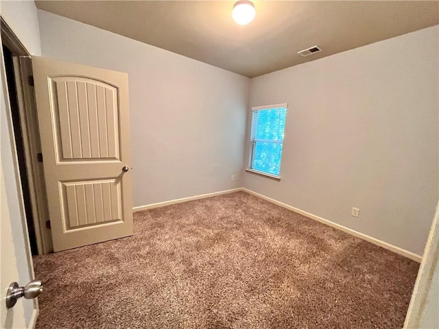 spare room with carpet floors