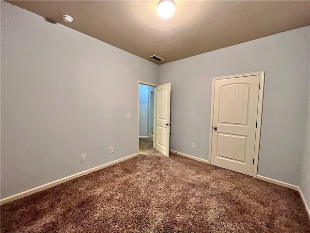 unfurnished bedroom featuring carpet