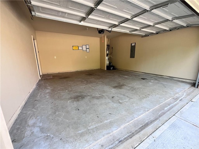 garage featuring electric panel and a garage door opener