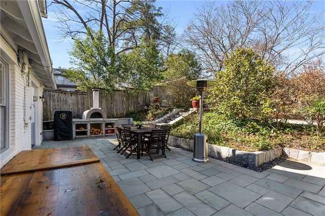 view of patio / terrace with a fenced backyard and outdoor dining space