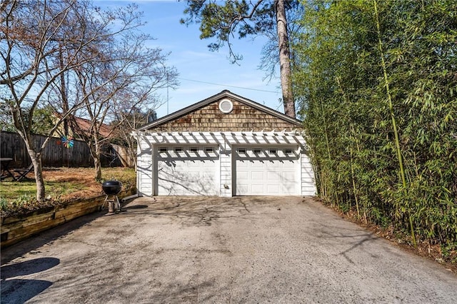 detached garage with fence