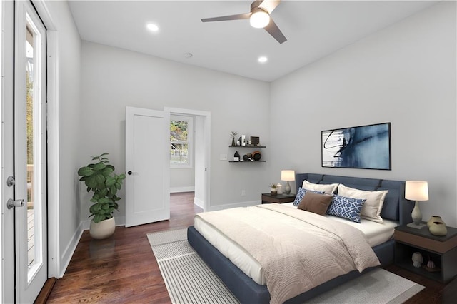 bedroom featuring ceiling fan and dark wood-type flooring