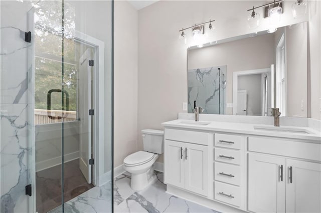 bathroom featuring toilet, an enclosed shower, and vanity