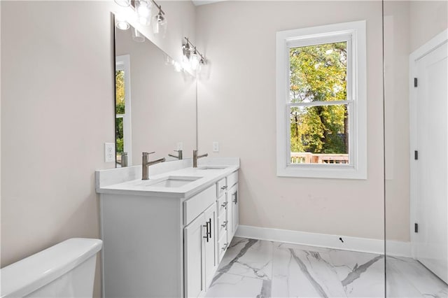 bathroom with toilet and vanity