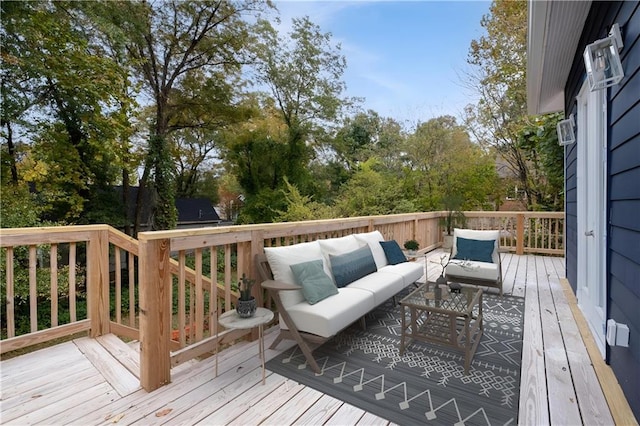 wooden terrace with an outdoor hangout area