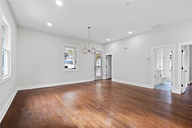 unfurnished room with dark hardwood / wood-style floors