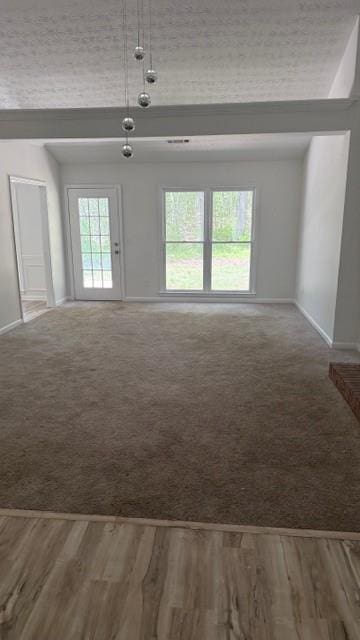 3510 Hog Mountain Rd, Dacula, GA 30019 - unfurnished living room featuring wood finished floors and carpet