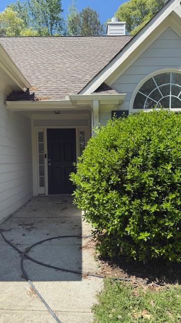 3510 Hog Mountain Rd, Dacula, GA 30019 - property entrance with roof with shingles and a chimney