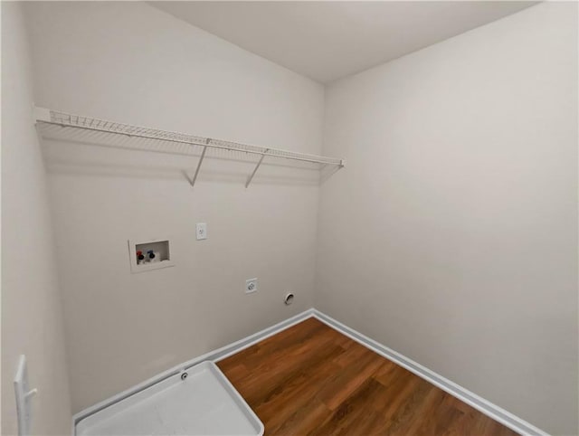 washroom with hookup for a washing machine, wood-type flooring, and hookup for an electric dryer