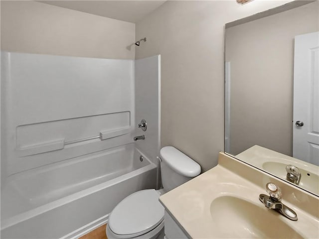 full bathroom with vanity, toilet, and washtub / shower combination